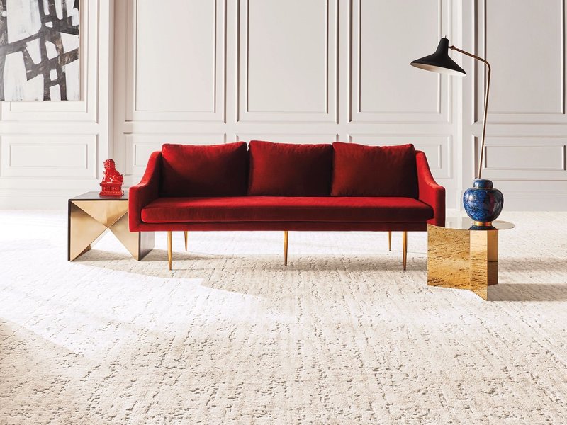 red sofa on carpet - bobbiejoes