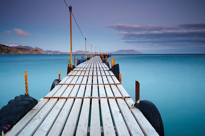 wood pier stretching over water